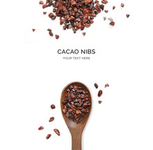 Creative Layout Made Of Cacao Nibs And Wood Spoon On A White Background. Top View.  