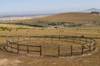 © Wavebreak Media - High angle view of wooden fence in circular shape on mountain against clear sky during sunny day