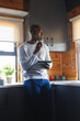 © Wavebreak Media - Thoughtful bald african american senior man with eyeglasses and tablet looking away in kitchen