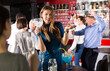 © JackF - Portrait of smiling girl drinking cocktail and dancing on corporate party