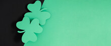 Patrick's Day Composition. Holiday Decoration For St. Patricks Day, Clover Leaf On Black And Green Background. Flat Lay, Top View, Copy Space 