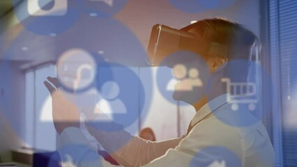 Poster - Animation of multiple digital icons against caucasian businessman wearing vr headset at office