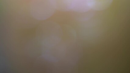 Wall Mural - Blue Bokeh Shimmers and Overflows. Lens Flare And Light Leaks in Circle Bokeh Form. Shiny defocused circles disappear. 4k Light Leaks abstract background, overlay or transition for footage composing.