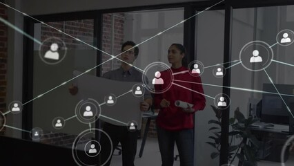 Poster - Animation of network of profile icons over diverse man and woman discussing over a plan at office