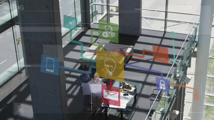 Poster - Animation of network of digital icons against aerial view of people working at office