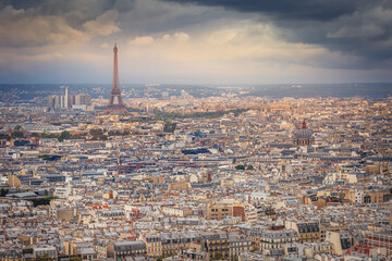 Poster - Paris skyline at sunset with Eiffel Tower above parisien roofs, Paris, France