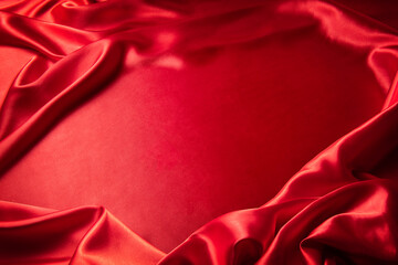 Wall Mural - シルクの赤い布を敷き詰めたテーブルの背景テクスチャー