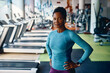 © Drazen - Portrait of confident black athletic woman in gym looking at camera.