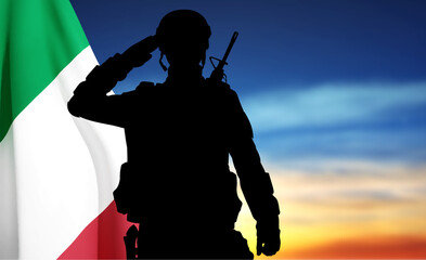 Canvas Print - Silhouette of saluting soldier with Italian flag on blured sunset background. EPS10 vector