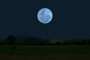 Wall Mural - full moon on sky with mountains silhouette in the night.