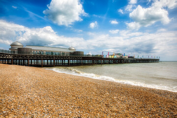 Canvas Print - The Famous Pier and the Pebbled Beach of Hastings, England