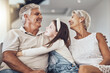 © Coetzee/peopleimages.com - Relax, love or grandparents hug a girl in living room bonding as a happy family in Australia with care. Retirement, smile or elderly man relaxing old woman with child at home together on fun holiday