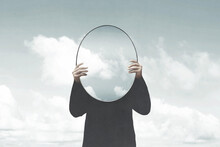 Illustration Of Woman In Black Holding A Surreal Mirror Among Clouds, Surreal Abstract Concept