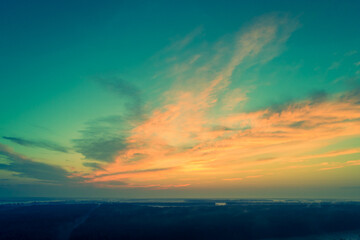 Wall Mural - Rural landscape in the evening with the dramatic evening sky. Aerial view. View from above of the countryside during sunset