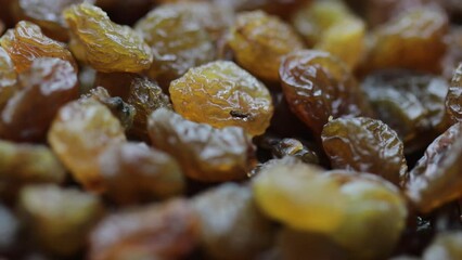 Poster - dried fruits. natural raisins rotate in circle