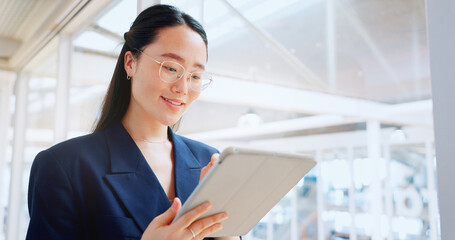 Business woman, tablet and technology, typing email for company communication or digital report. Internet, wifi and ux, networking and Asian employee with smile and inspiration in Japan office