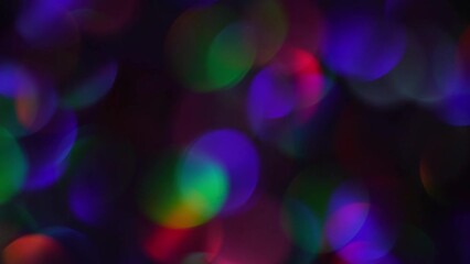 Wall Mural - Abstract defocused lights, Colorful Bokeh. Blur multicolored confetti background with bokeh for carnival. Neon bokeh motion with blue, green, magenta and purple colors on dark background. 