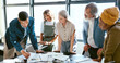 © A.S./peopleimages.com - Business people, tablet and teamwork for planning, strategy and ideas by desk in modern office for goal. Corporate group, digital tech and finance team for brainstorming, vision or target in New York