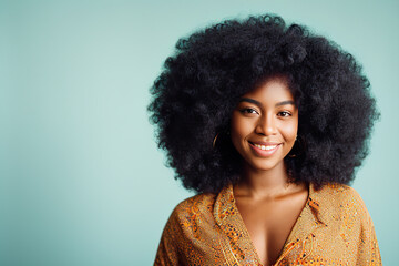 Portrait of pretty cheerful wavy-haired girl applying spray in modern hair care set isolated over green toned background