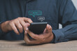 © Bordinthorn - businessman using smartphone typing Live chat chatting and social network concepts, chatting conversation working on mobile phone in chat box icons pop up. Social media marketing technology concept.
