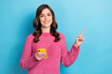 Poster - Photo of charming positive lady wear trendy pink clothes demonstrate empty space modern technology shop isolated on blue color background