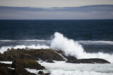 Fototapeta Morze - Ocean waves crashing on a rocky shore