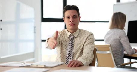 Wall Mural - Businessman holds out hand for greeting handshake with partner in office