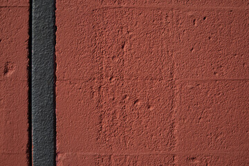 Textured red color brick wall background closeup