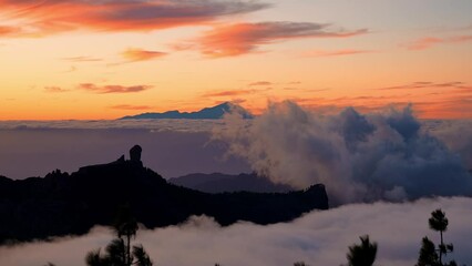 Wall Mural - Magical sunset above the clouds of the Teide volcano national park on Tenerife. Sunset from the top of Gran Canaria Island. Pico de las Nieves.