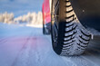 © robertharding - Winter tyre of car driving on slippery road in the snowy forest, Kangos, Norrbotten County, Lapland, Sweden, Scandinavia, Europe
