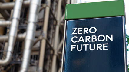 zero carbon future on a sign in front of an industrial building