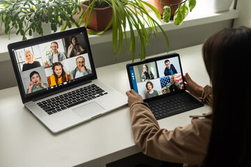 Wall Mural - Virtual meeting online. Video conference by laptop. Online business meeting. On the laptop screen, people who gathered in a video conference to work on-line,