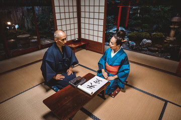 Wall Mural - Senior couple lifestyle moments in a traditional japanese house