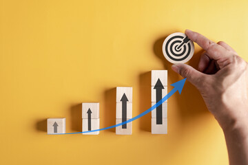Aufkleber - Stock market and exchange chart concept.  wooden block stack business chart or graph with arrows icon. Stock market and economy growth of investment.