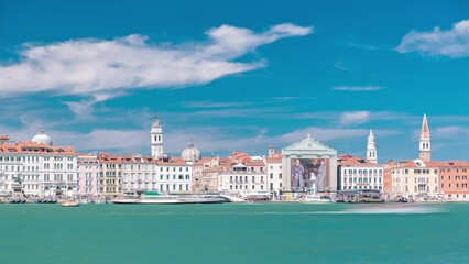 Wall Mural - Venice panorama timelapse with Doge's Palace, Santa Maria della Visitazione seen from the bell tower of the St. George. Blue cloudy sky at summer day