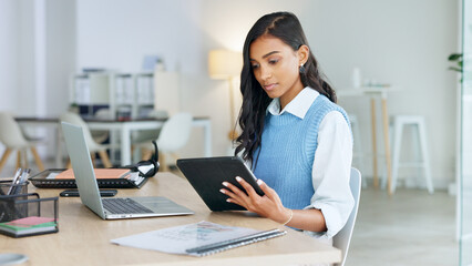 Poster - Trendy marketing professional using an online app to network, meet deadlines and stay connected during office hours. Young business woman using her laptop and tablet while working in the office.