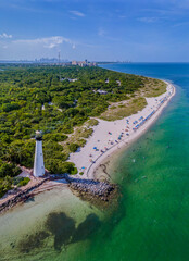 Canvas Print - Aerial view of Bill Baggs Cape Florida State Park against ocean in Miami Florida. The historic Cape Florida Old Tower Lighthouse and Cape Florida Beach can also be seen in this scenic landscape.