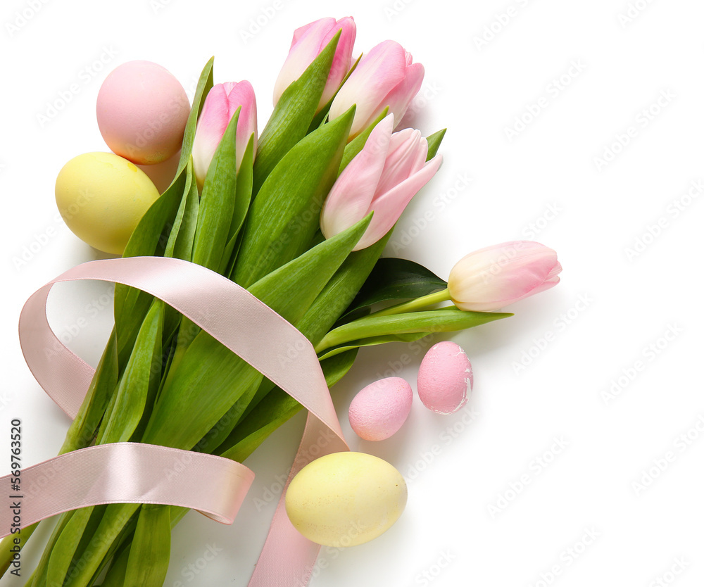 Bouquet of beautiful tulip flowers and Easter eggs on white background