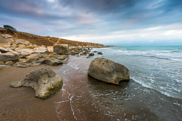 Wall Mural - Rocky sea coast in cloudy weather