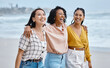 © K Davis/peopleimages.com - Friends, diversity and beach, hug and walk while laughing, relax and talking against nature background. Travel, women and group embrace while walking at the sea, happy and smile on ocean trip in Bali