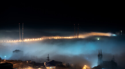 Fototapete - Cityscape night view. Fog over the city.