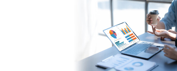 Pointing laptop, Meeting and consulting agenda of indian asia mixed race business man and female china half thai ethnicity bookkeepers discussing balance sheet, stock market profit with yearly tax.