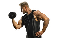 Handsome Muscular Man Training Pumping Up Muscles With Dumbbell. Strong Bodybuilder With Perfect Deltoid Muscles, Shoulders, Biceps, Triceps And Chest