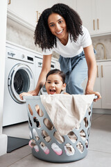 Poster - Portrait of a mother with her kid in a laundry basket at their home while washing clothes together. Happiness, housework and face of young woman having fun with girl kid while cleaning the house.