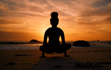 Sticker - Sunset, yoga and silhouette of a woman on the beach in a lotus pose doing a meditation exercise by the sea. Peace, zen and shadow of a calm female doing a pilates workout outdoor at dusk by the ocean