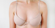 © Olena Poberezhna - Woman in natural bra over isolated background