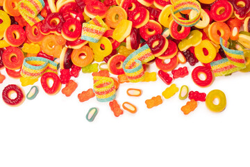 Assorted colorful gummy candies. Top view. Jelly donuts. Jelly bears. Isolated on a white background.