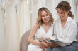 A Bride-To-Be shopping for a wedding dress in a Bridal Boutique.