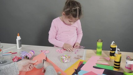 Wall Mural - Kids papercraft. Making paper bugs out of the empty toilet paper rolls and construction paper.