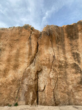 Sheer Sandstone Rock With Artistic Cracks. Cyprus, Paphos. March, 2022.